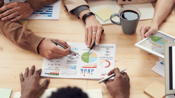 Office professionals representing PayPal job restructuring in India