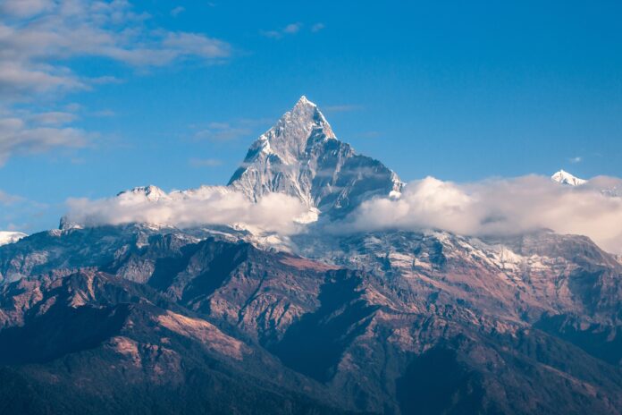 Snowy mountain peaks representing Everest expedition and mountaineering